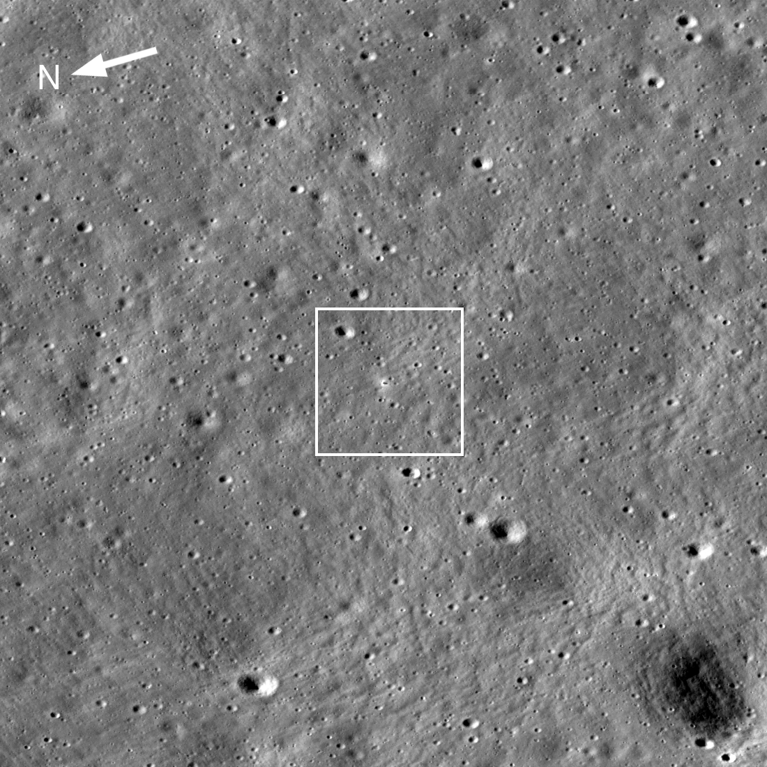 Annotated version of orbital view showing north arrow and box around lander