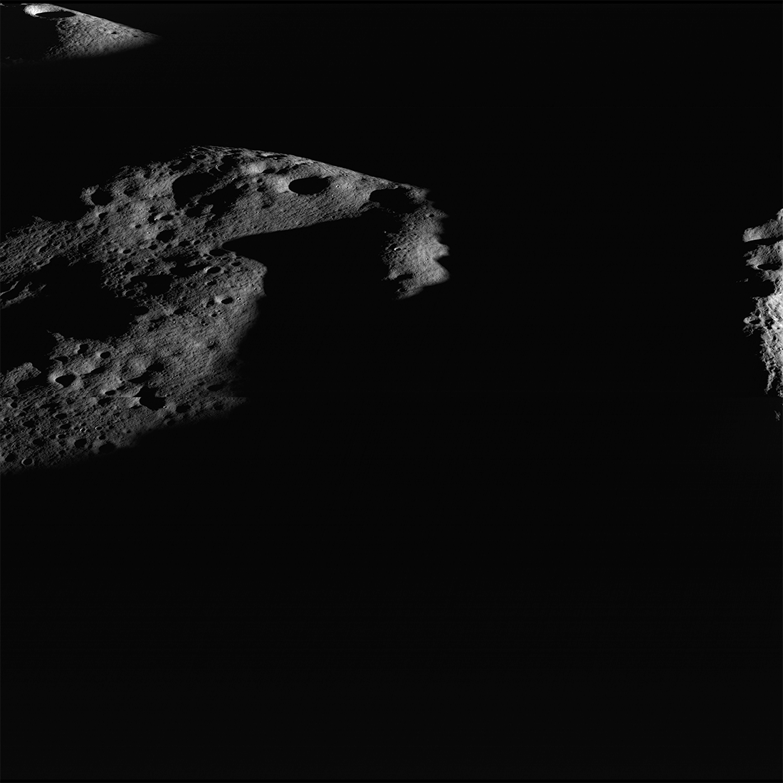 Image of illuminated peaks near the rim of Shackleton crater